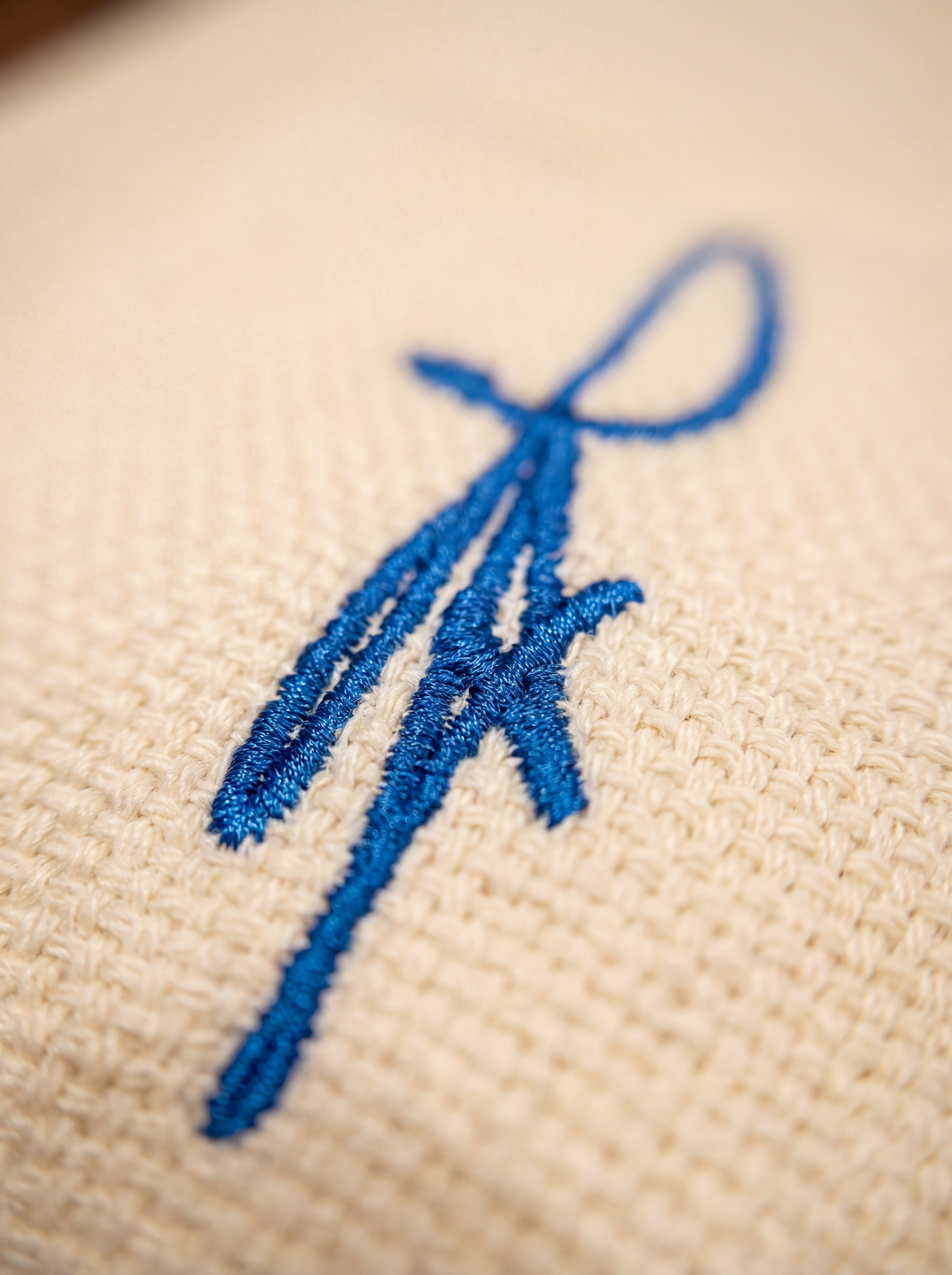 ARYO signature embroidery on the ivory Essential Trouser